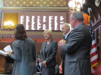 Tami Zawistowski after taking oath from Secretary of the State Denise Merrill. At right, her husband, Ed, and Rep. Lawrence F. Cafero Jr.