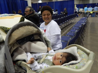This is a picture of Nayely Reyes of South Windsor and her 9-month-old son, Nathan, who both got dental care at the Connecticut Mission of Mercy free clinic Friday.