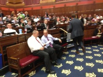House Majority Leader Joseph Aresimowicz huddles Thursday with his GOP counterpart, Lawrence F. Cafero.