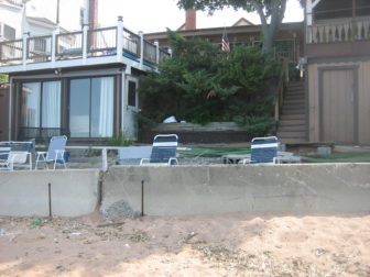 David Kronberg's home on Morris Cove in New Haven still has unrepaired damage from Storm Sandy nearly two years ago. The city has been approved for nearly $2 million in federal Sandy funding to build a seawall where temporary Jersey barriers are now. But it will be a race against the clock to meet the time limit on those funds.