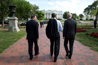 VA chief nominee McDonald walks with President Obama and Vice President Joe Biden.