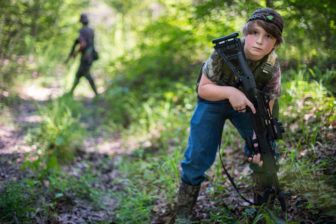 Dalton Davis, 10, participates in a patrol drill in the woods of Batesville, Miss., with the Citizens Militia of Mississippi.
