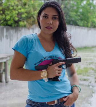 A former Olympian from Venezuela, Gabby Franco was one of the first women to compete on History’s “Top Shot” reality show. Picking a favorite gun is like trying to pick a favorite shoe, she said. (Photo by Natalie Krebs/News21)