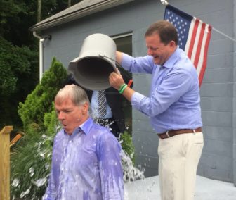 John P. McKinney douses Foley after the day after the GOP primary as part of the ALS ice bucket challenge.
