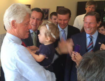 President Clinton, a grandfather-to-be, practices as Gov. Dannel P. Malloy and Sens. Chris Murphy and Richard Blumenthal watch.