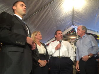 Chris Christie, flanked by Heather Bond Somers, Tom Foley and an aide.