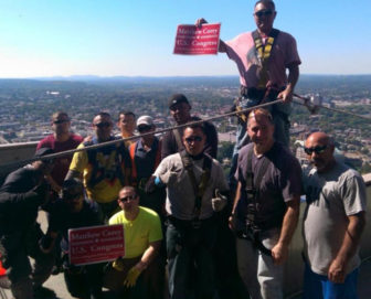 Republican challenger Matthew Corey, second from right in front, with his window cleaning staff.