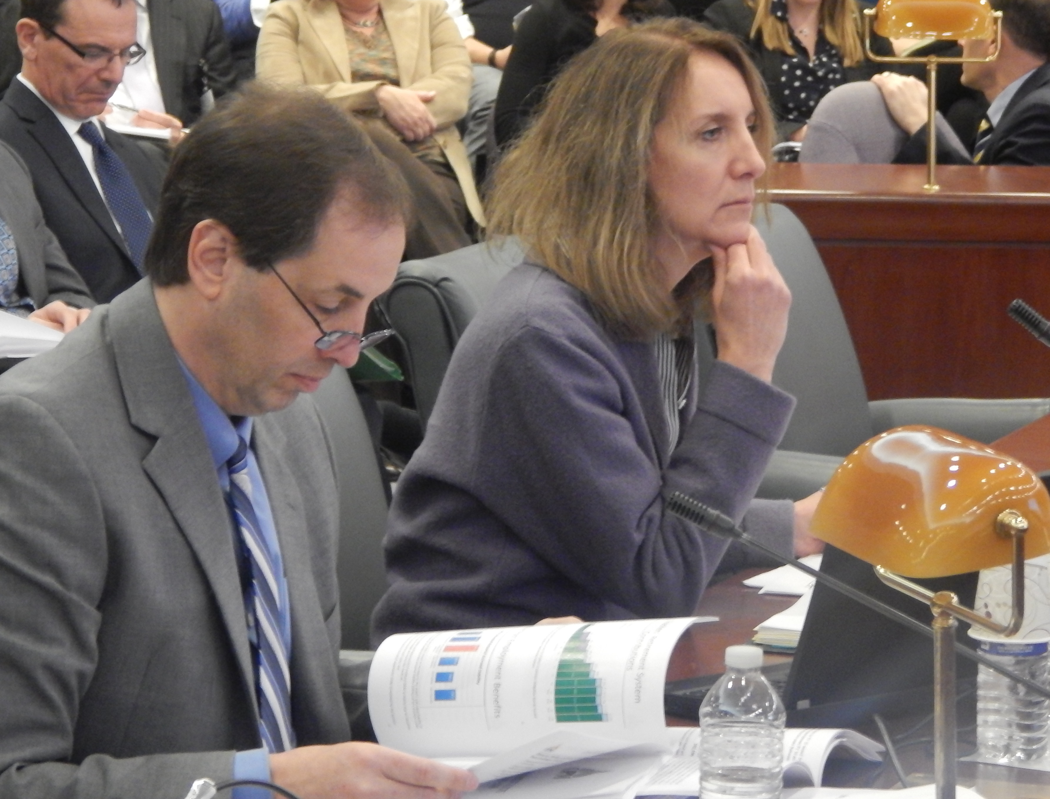 Alan Calandro, executive director of the Office of Fiscal Analysis, and Karen Buffkin, deputy budget director for the Malloy administration, answer legislators' questions Friday.