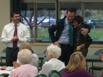Gov. Dannel P. Malloy embraces Rosa DeLauro. At left, James Albis.