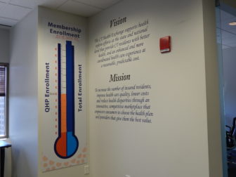 Access Health CT, the state's health insurance exchange, tracks enrollment on a sign in its lobby. In preparation of the next round of open enrollment, the tracker is back to zero.