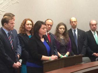 Hockley speaking Monday, flanked by Sen. RIchard Blumenthal, Rep. Elizabeth Esty, Mark Barden and others.