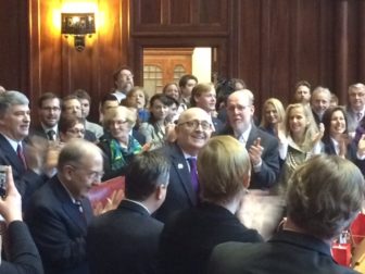 Sen. Andrew Maynard, D-Stonington, acknowledges applause on his return to the Senate.