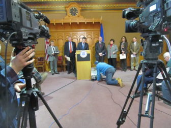 Gov. Dannel P. Malloy, Attorney General George Jepsen, Comproller Kevin Lembo and others at a televised news conference on the Anthem cyber attack.