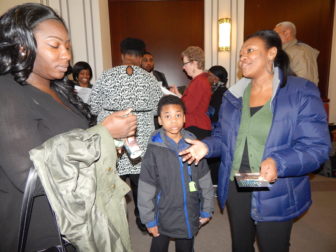 Parents hoping to get their children into a charter school traveled to Hartford last week. Pictured are parents from Stamford Nefretiria Gross (Left) and Dorothy St-Louis with her son.