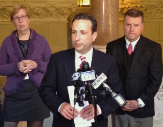 Senate Majority Leader Robert Duff, D-Norwalk, at microphones, flanked by Sen. Cathy Osten, D-Sprague, and Sen. Tim Larson, D-East Hartford.