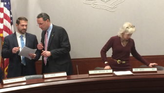 Sen. Paul Doyle, center, consults with staff at start of Energy and Technology Committee. At right is his co-chair, Rep. Lonnie Reed.