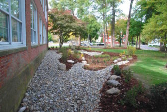 A rain garden installed to solve a ponding problem at a Milford government building