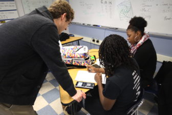 Teacher Ross Hanson working with students in his Advanced Placement Calculus class at Bloomfield High School.