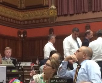 House Minority Leader Themis Klarides and Rep. Jason Perillo watch votes cast for GOP reforms.
