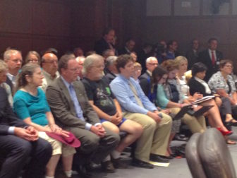 Spectators and waiting speakers at the Republican forum on tax increase proposals