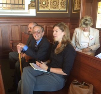Robert Crook, with cane, watching the vote tally for Sunday hunting. He sought the bill for 20 years.