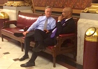 Speaker J. Brendan Sharkey speaks with Rep. Ernest Hewett of New London at 4 a.m. Wednesday.