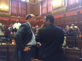 Reps. Stephen Dargan, left) and Bruce Morris during the excessive force debate.