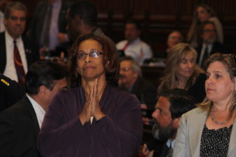 Rep. Toni Walker, the chairwoman of the legislature's Appropriations Committee, watches the vote board in the House