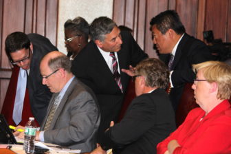 Senate Minority Leader Len Fasano confers with members of his caucus.