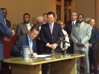 Gov. Dannel P. Malloy signing his "Second Chance Society" bill.