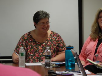 Terri DiPietro, Middlesex Hospital's director of outpatient behavioral health, presents cases at a Community Care Team meeting.