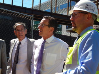 Gov. Dannel P. Malloy views the construction site where an outpatient center was being built on the UConn Health Center campus in Farmington. At left is Dr. Frank Torti, then the dean of the medical school.