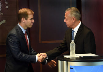 HARTFORD-8/19/15- hc-hartford-mayoral-Hartford Mayoral Candidates Luke Bronin, left, and Mayor Pedro Segarra shake hands before a debate held at The Hartford Courant.