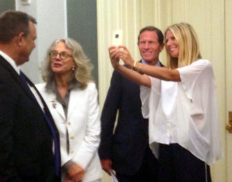 Actress Gwyneth Paltrow snaps a selfie with Sen. Richard Blumenthal during a GMO-labeling advocacy event. Her mother, actress