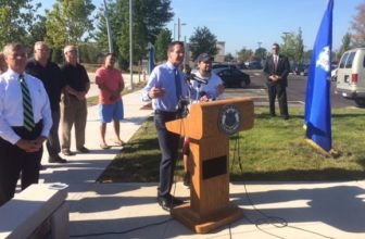 Gov. Dannel P. Malloy with John Colon, a daily commuter on CTfastrak. Commissioner James Redeker is at left.