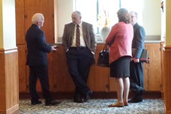UConn officials involved in upcoming salary negotiations have a chat in the hall. They are, l-r, Michael Bailey, ; UConn Ombuds Officer Jim Wahl; Provost Sally Reis and Michael Eagen,