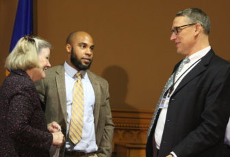 Ben Barnes, the governor's budget director, talks with experts from Boston College's Center for Retirement Research.