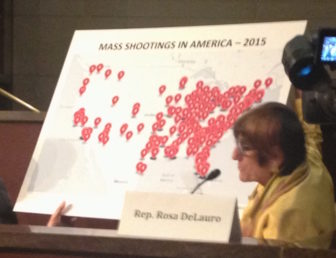 U.S. Rep. Rosa DeLauro with a map showing the sites of shootings this year.