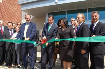 Gov. Malloy cuts the ribbon at JM Wright Technical High School, which the state spent millions to renovate.