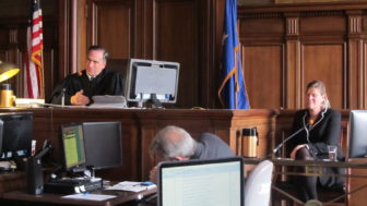 Hartford Superior Court Judge Thomas Moukawsher listens to an attorney for the plaintiffs question Sharon Locke, at right, about her experiences as a district administrator in New Britain Public Schools. Locke now serves as the superintendent in Naugatuck.
