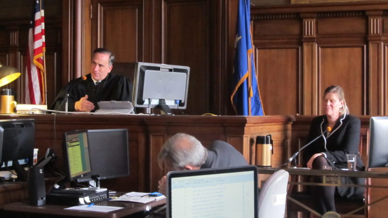 Hartford Superior Court Judge Thomas Moukawsher listens to an attorney for the plaintiffs question Sharon Locke, at right, about her experiences as a district administrator in New Britain Public Schools. Locke now serves as the superintendent in Naugatuck.