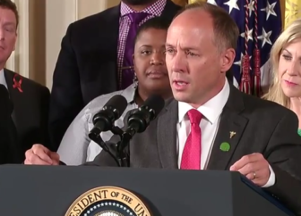 Mark Barden, who lost his 7-year-old son Daniel in the Newtown shootings, introduces the president.