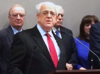 Paul Timpanelli, president and CEO of the Bridgeport Regional Business Council, comments on the governor's proposed budget Tuesday. Behind him are Tony Sheridan, president of the Chamber of Commerce of Eastern Connecticut, left, and Larry McHugh, president of the Middlesex County Chamber of Commerce.