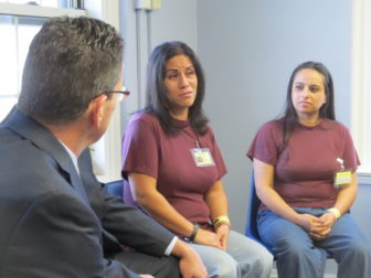 Gov. Dannel P. Malloy listens to Damaris Vega Torres.