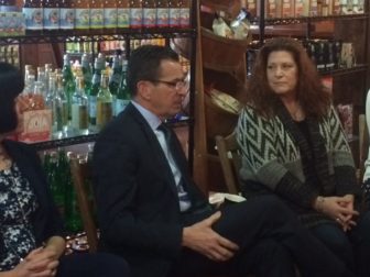 Gov. Dannel P. Malloy and Patti Silva, who fears her daughter could lose state services.