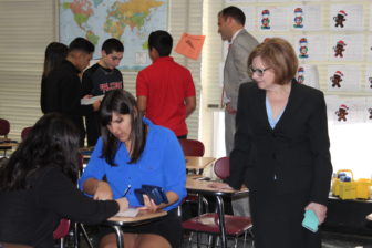 Education Commissioner Dianna Wentzell watches students in a class for English Language Learners at East Hartford Middle School.