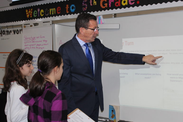 Gov. Malloy works with students on a lesson in a fifth grade class at an elementary school in Cromwell.