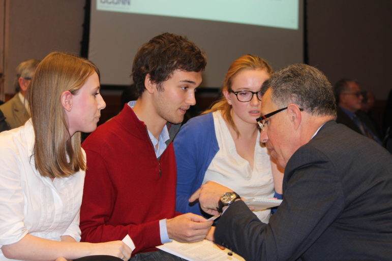 Students at UConn share their concerns about research investments at UConn with the executive vice president for research after a recent Board of Trustees meeting