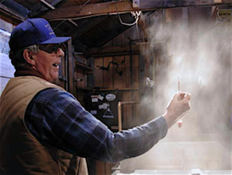 Ron Wenzel of the Wenzel Sugarhouse in Hebron tests the maple sap as it concentrates into syrup.