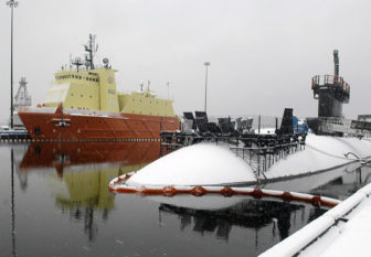 The Los Angeles-class fast attack submarine USS Alexandria (SSN 757) and the Submarine Support Vessel (SSV) Carolyn Chouest sit covered in snow on a blustery, snowy day at Naval Submarine Base New London in Groton.